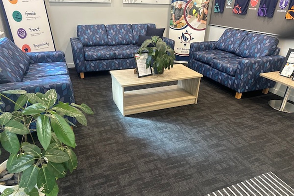 Reupholstered sofas installed in a school reception area